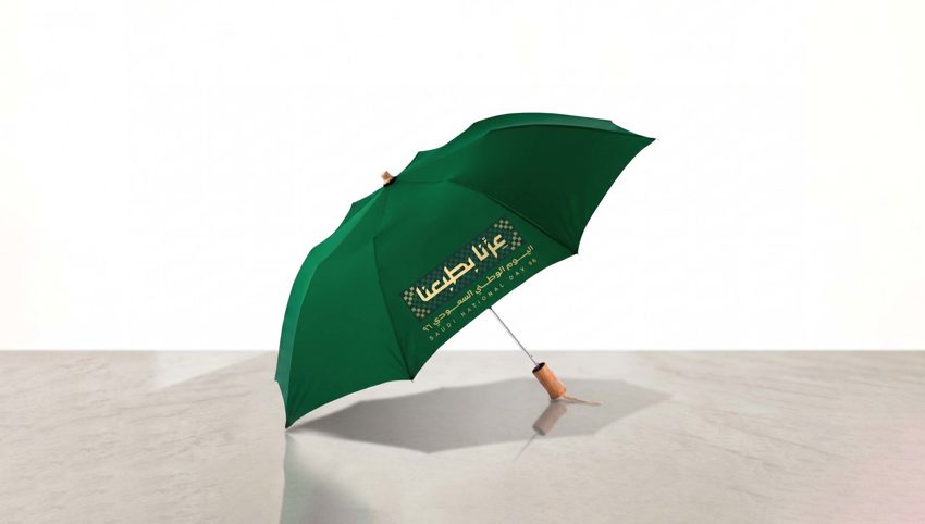 Custom branded golf umbrella with company logo — Admark, Saudi Arabia Printed patio umbrella with brand colours for a cafe —