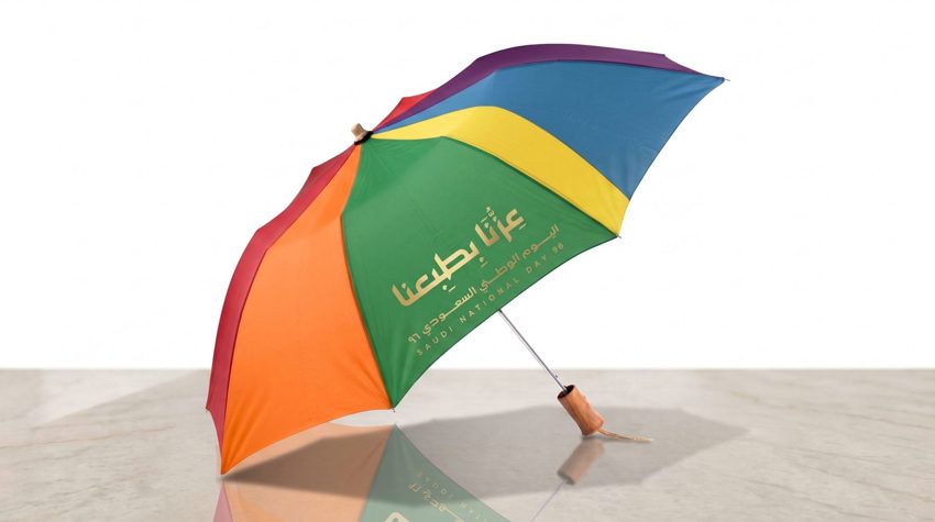 Custom branded golf umbrella with company logo — Admark, Saudi Arabia Printed patio umbrella with brand colours for a cafe —